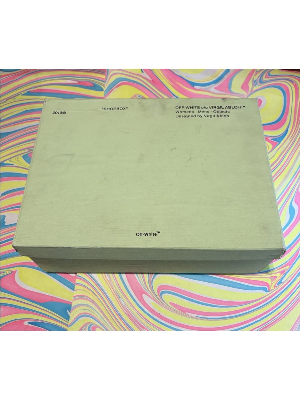 Empty off white shoe box with duster
